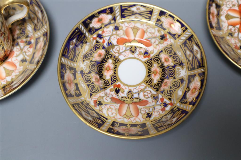 A Royal Crown Derby part tea service, pattern no. 2451, a similar vase and a sugar scuttle (faults)